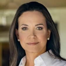 Portrait of a woman with long dark hair in a white shirt